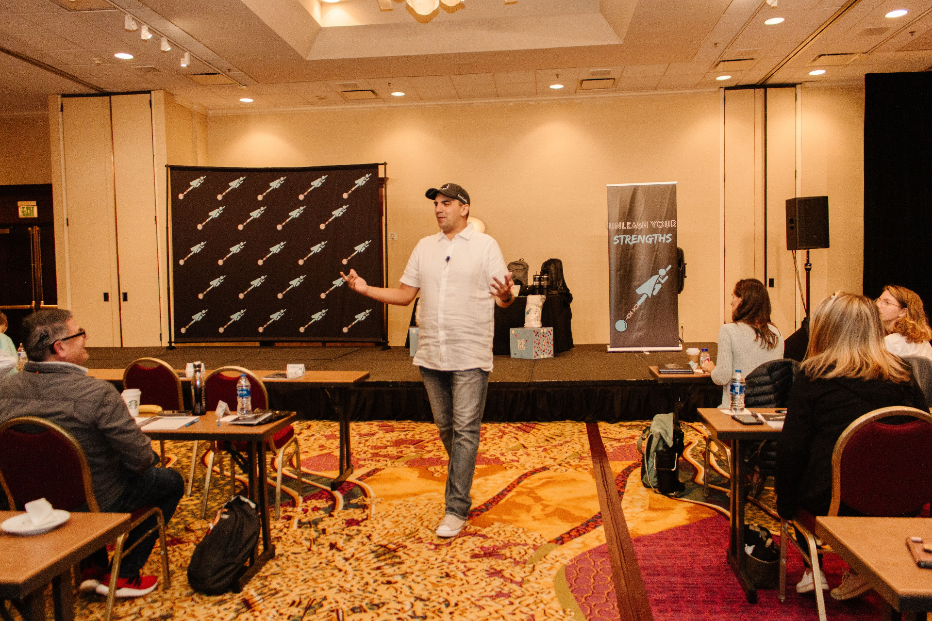 Eddie Villa teaching strengths to a room full of people